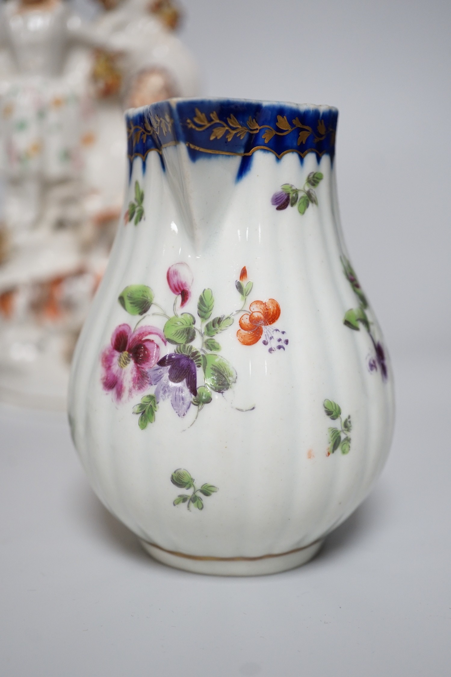 A Worcester milk jug, c.1780, a Newhall-type cream jug, c.1795, a Staffordshire porcelain model of an eagle, c.1830-40, 17cm high, and two Staffordshire porcellaneous models
